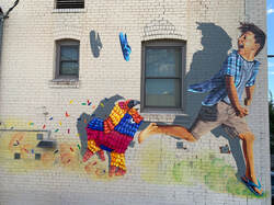Running of the Piñatas mural by Ignacio Garcia
